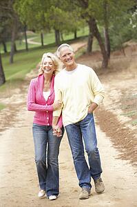 Senior Couple enjoying walk in park