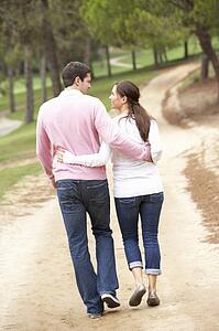Romantic couple enjoying walk in park