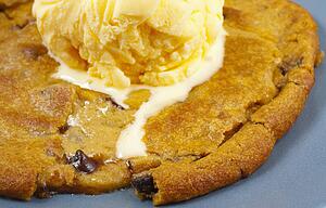 Ice Cream Melting On Top Of A Cookie
