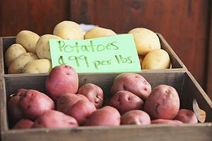 red and white potatoes in a crate for sale; troutdale, oregon, united states of america