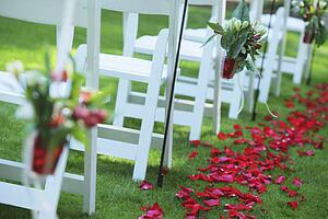 a path of rose petals behind a row of white chairs; troutdale, oregon, united states of america
