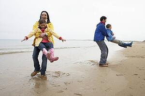 Family playing on beach