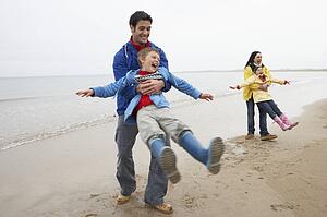 Family playing on beach