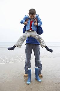 Father and son on beach