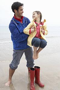 Father and daughter on beach