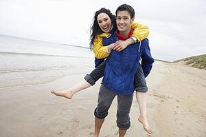 Happy couple on beach in love