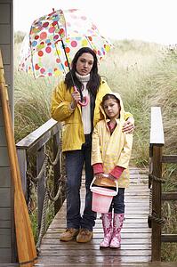 Mother and daughter with umbrella