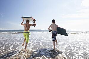 Teenagers surfing