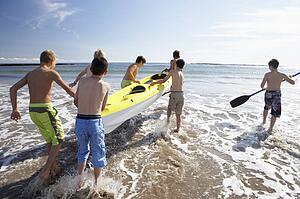 Teenage boys kayaking