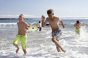 Teenagers playing on beach