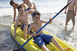 Teenage boys kayaking