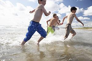 Teenagers playing on beach