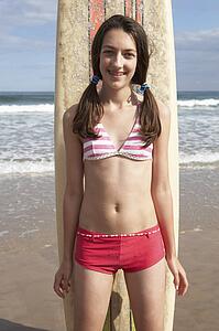 Teenager girl with surf