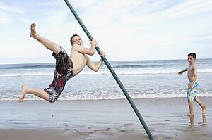 Teenagers playing on beach