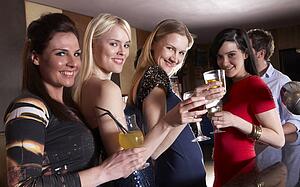 Young women posing at party