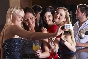 Young women drinking at bar