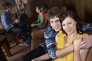Young happy couple in cafe