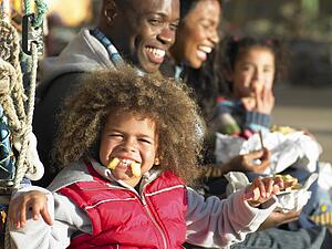 Happy family having picnic