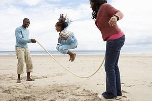 Family playing on beach