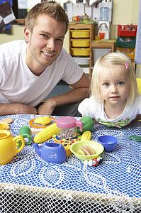 Man with children playing together