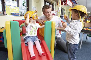 Man with children playing together