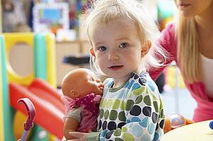 Young girl playing with toys
