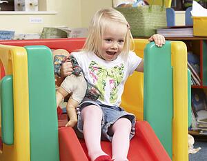 Young girl playing with toys