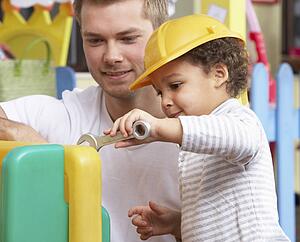 Man with children playing together