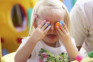 Young girl playing with toys