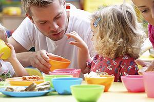 Man with children playing together