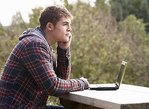 Young man with laptop computer