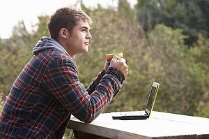 Young man with laptop computer