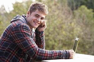 Young man with laptop computer