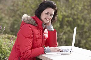 Young woman with laptop computer