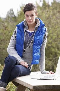 Young woman with laptop computer
