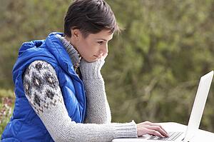 Young woman with laptop computer