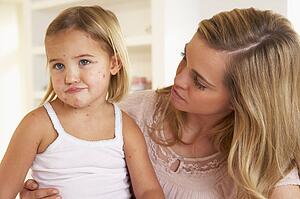 Mother nursing sick child