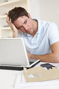 Young man working with laptop computer