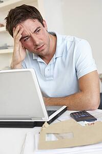 Young man working with laptop computer