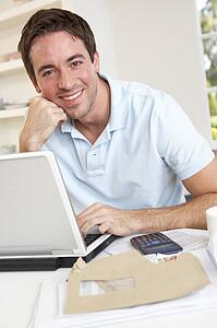 Young man working with laptop computer