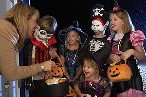 Happy Halloween party with children trick or treating