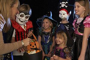 Happy Halloween party with children trick or treating