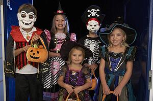 Happy Halloween party with children trick or treating