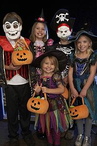 Happy Halloween party with children trick or treating