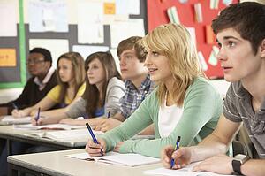 Teenage Students Studying In Classroom