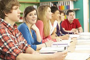 Teenage Students Studying In Classroom