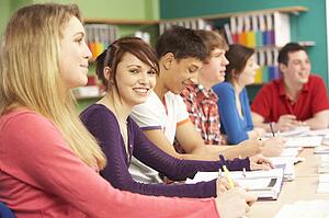 Teenage Students Studying In Classroom