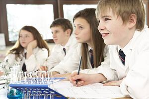 Group Of Teenage Students In Science Class