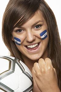 Young Female Sports Fan With Honduras Flag Painted On Face