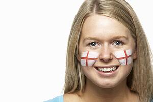 Young Female Sports Fan With St Georges Flag Painted On Face